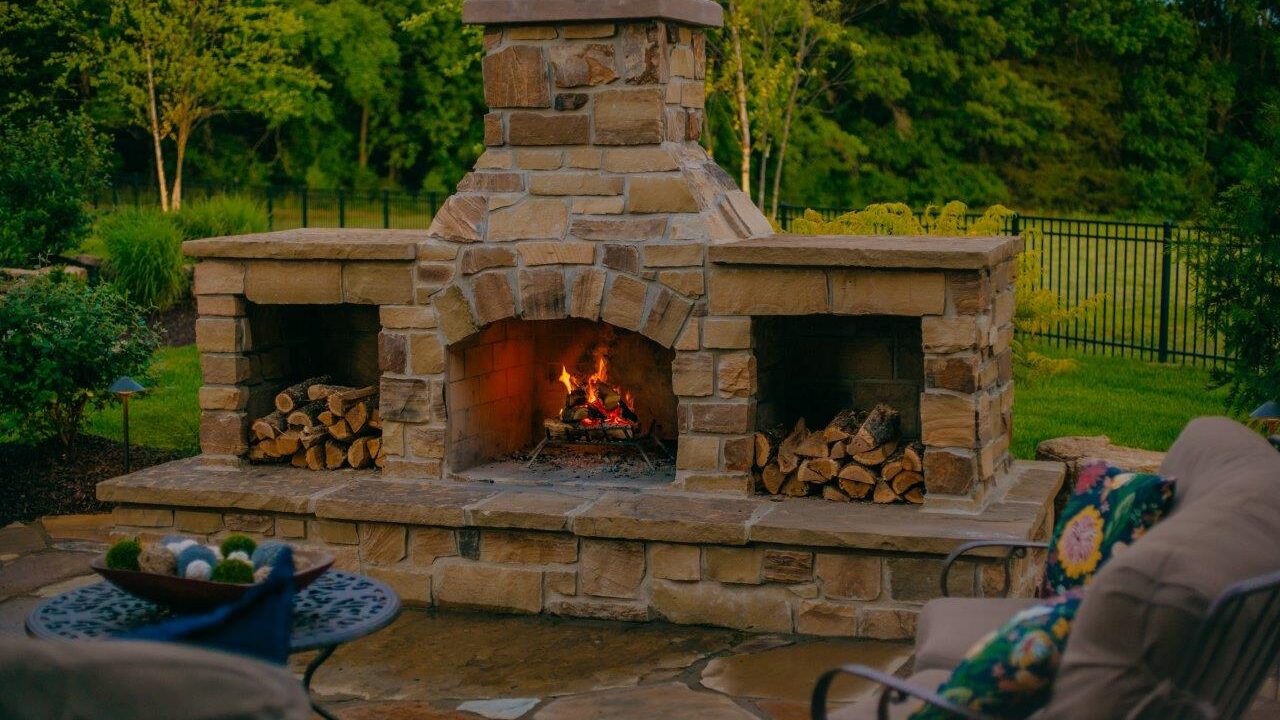outdoor stone fireplace with seating
