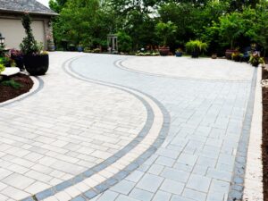 driveway made of pavers layed out in a curved design