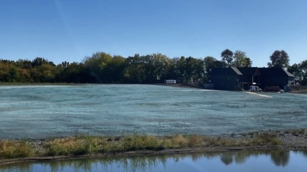Hydroseeding a field.